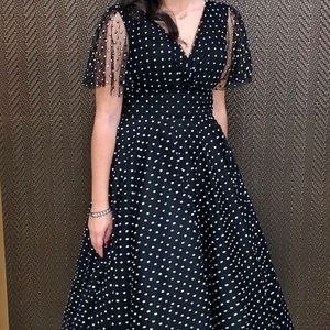 1950’s inspired cocktail dress. Jadore 38. Black with gold/silver pokadots.